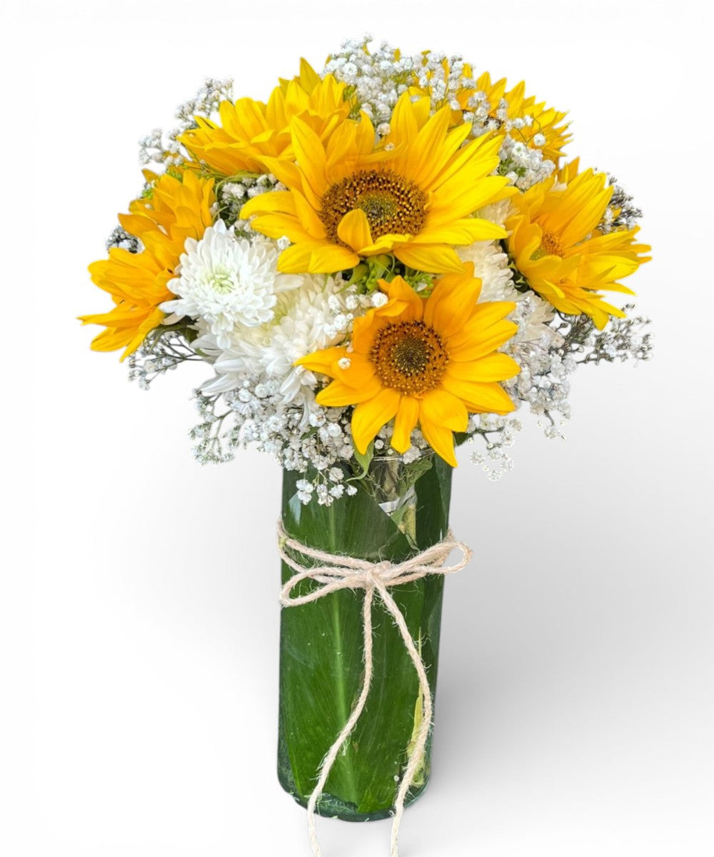 Sunflowers and cherries in a vase