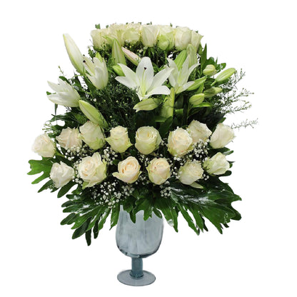 4 Lilies & 30 White Imported Flowers in Rounded Vase