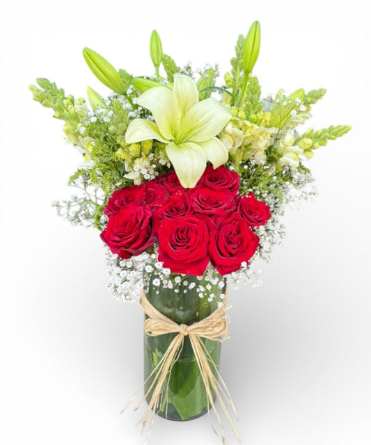 Lily, a red rose in a vase