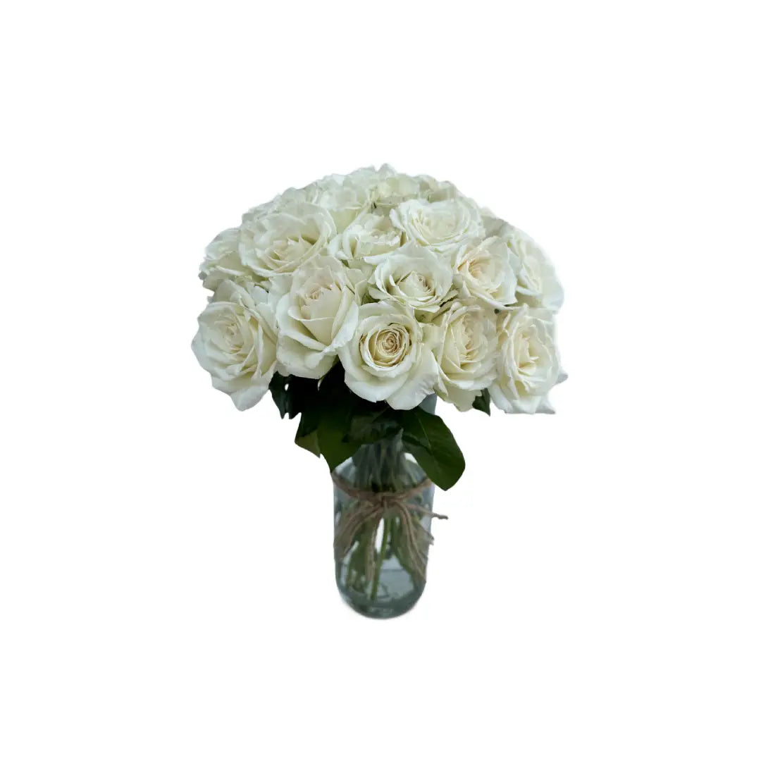 White roses in glass vase